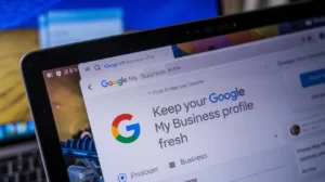 Laptop screen displays the Google My Business page with the headline “Keep your Google My Business profile fresh.”
